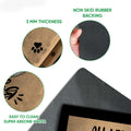Close-up feature view of Persian cat doormat surface, black rubber backing, and paw print artwork