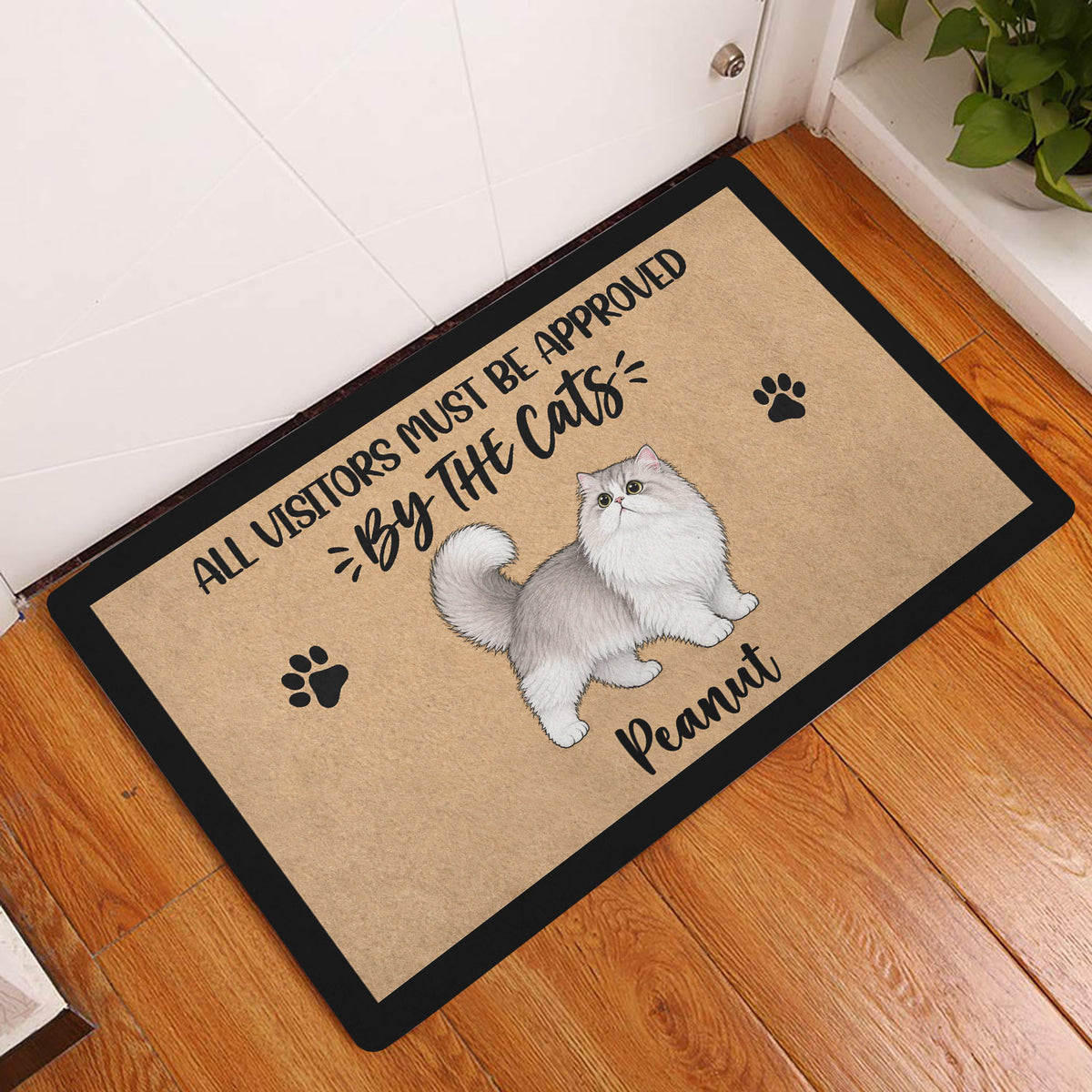 Persian cat doormat displayed at an indoor doorway on a warm wood floor