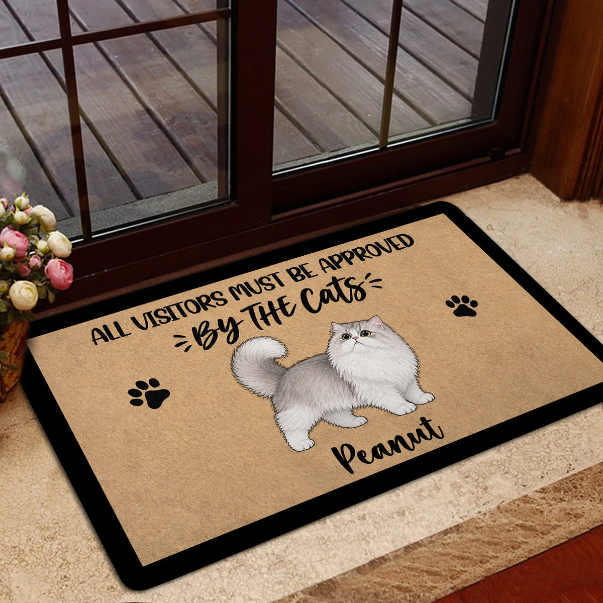 Persian cat doormat styled at a home entrance with glass doors and warm interior decor