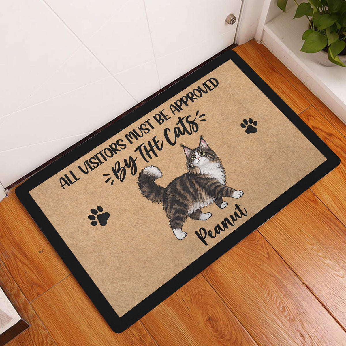 Maine Coon cat doormat styled in a home entryway on a warm wood floor