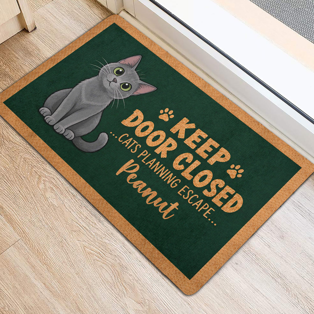 Gray Russian Blue cat door mat displayed near a doorway with a green printed surface