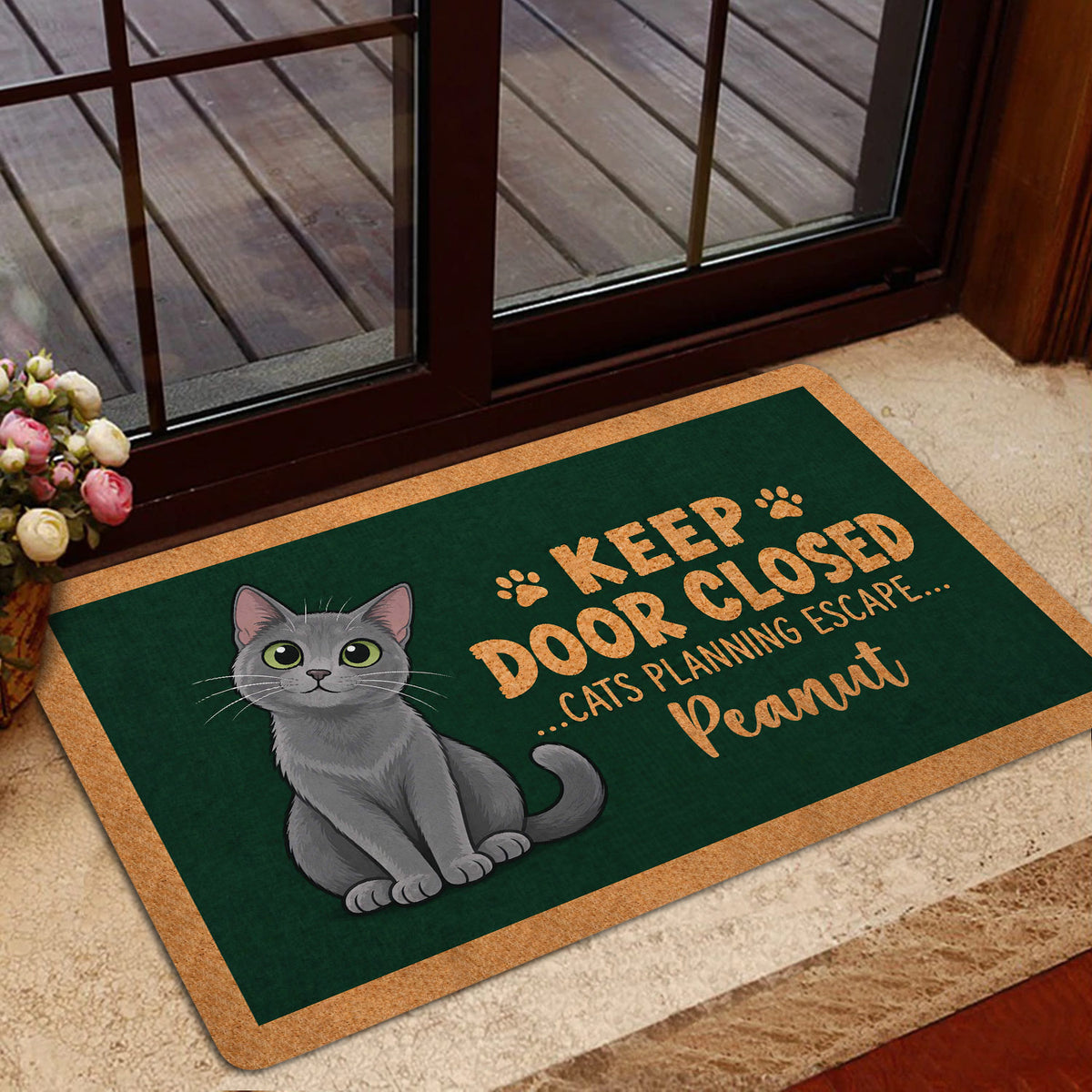 Russian Blue cat doormat welcoming guests at a glass entry door
