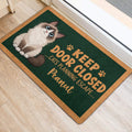 Ragdoll cat entryway rug displayed beside a doorway with a green and tan design