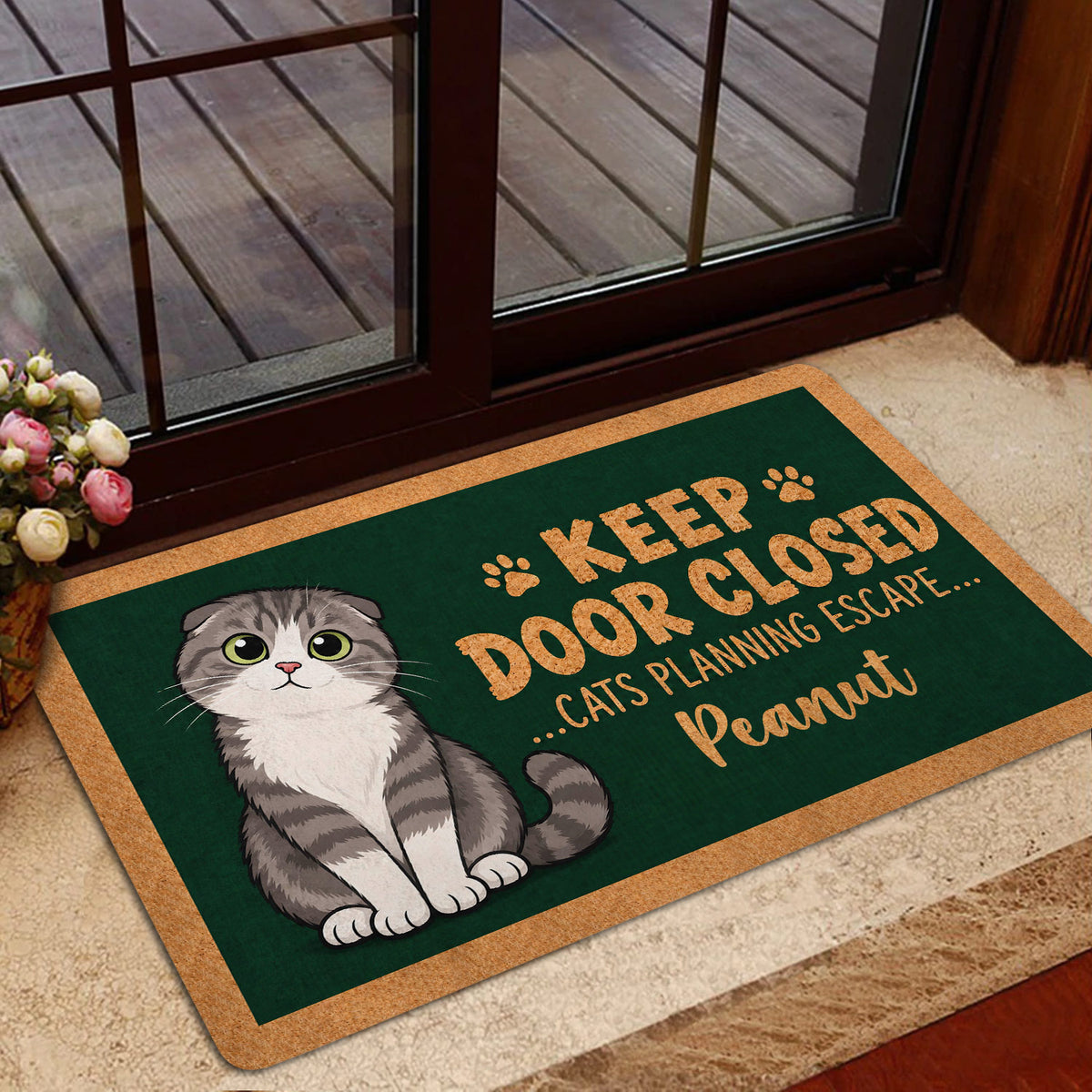 Scottish Fold cat doormat styled inside a glass doorway with a playful pet-themed design