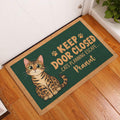Bengal cat entryway mat displayed beside a white door on a warm wood floor