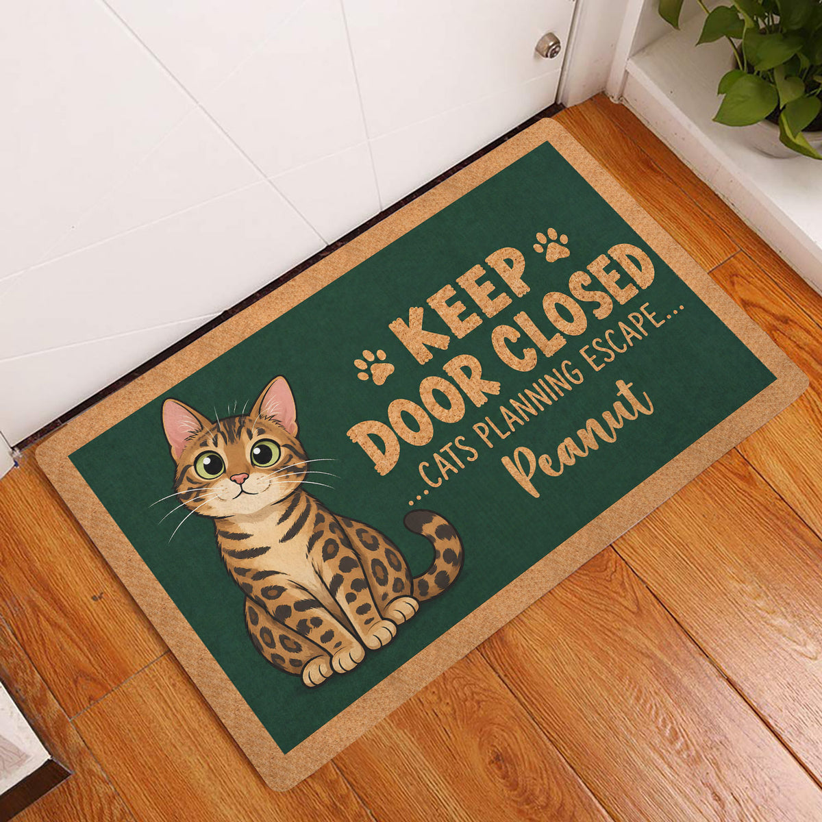 Bengal cat entryway mat displayed beside a white door on a warm wood floor