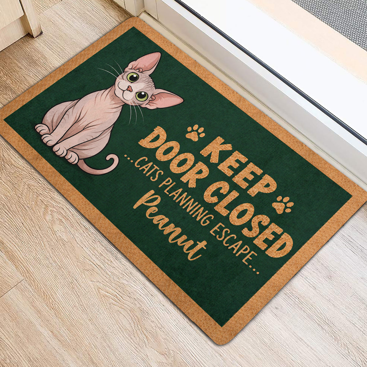 Sphynx cat rug-style doormat placed near a doorway on light wood flooring