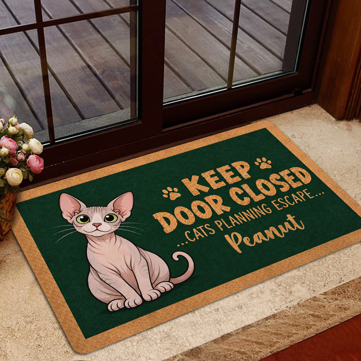 Sphynx cat doormat styled in a home entrance with glass doors, flowers and neutral flooring