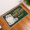 Persian cat doormat displayed in a wood-floor entryway beside a white door