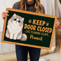 Person holding a Persian cat doormat featuring a fluffy cat and playful entryway artwork