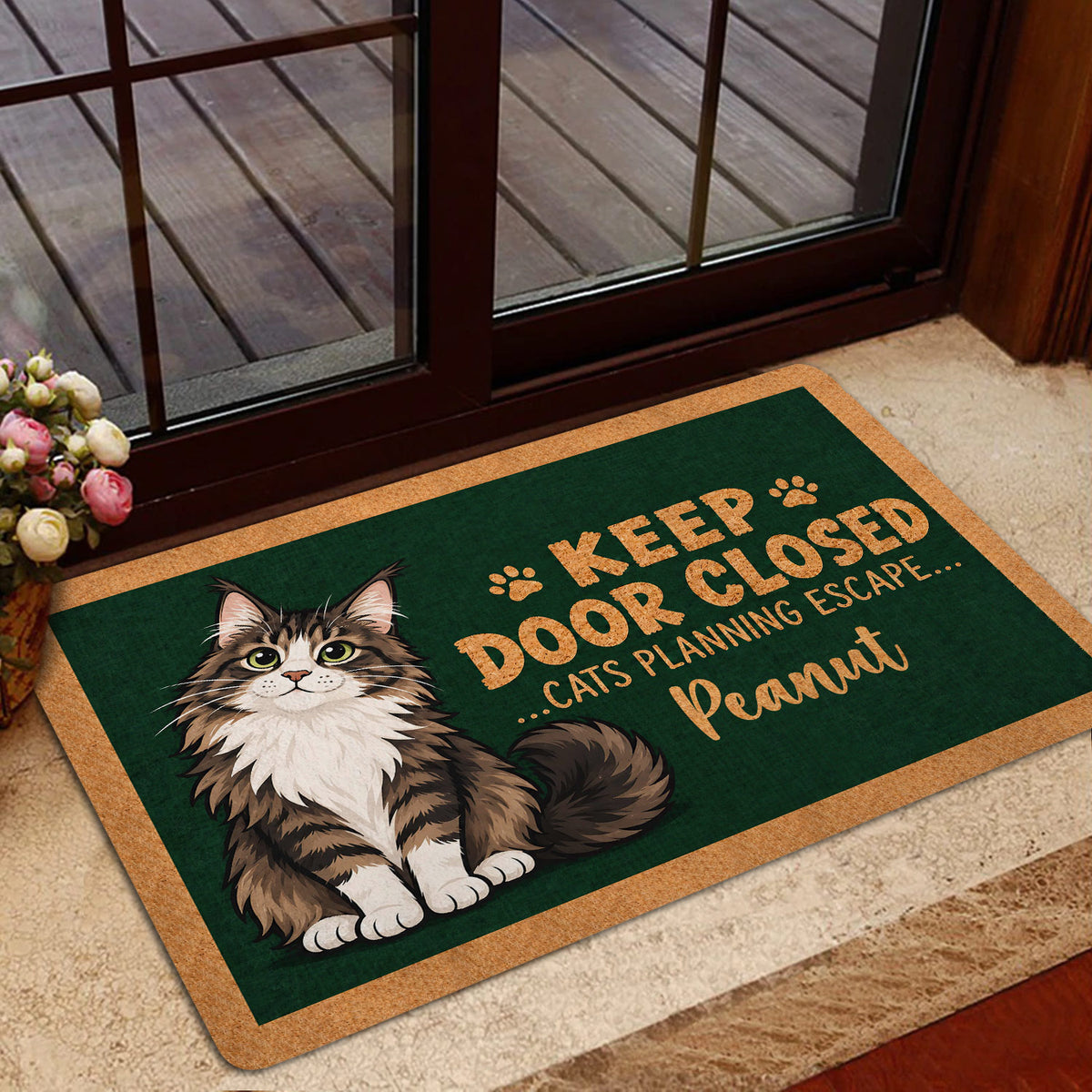 Maine Coon doormat styled inside a home entrance near glass doors and a floral arrangement