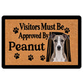 Whippet doormat with a black-and-tan design, paw prints, dog portrait, and playful visitor message
