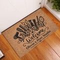 Hairstylist doormat displayed at an indoor doorway on a hardwood floor with salon tool artwork