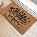 Hairdresser welcome doormat placed inside an entryway with black salon tool and floral artwork