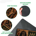 Close-up of African mask artwork on the doormat with a view of its black rubber backing