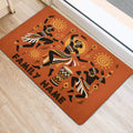 African-inspired entryway rug with dancing figures, sun motifs, geometric artwork, and a hand drum