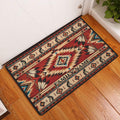 American Native entryway rug displayed by a door with geometric bands, feather motifs, and warm Southwestern colors