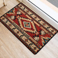 American Native patterned door mat placed at an entrance, featuring geometric shapes, feathers, and earthy red tones