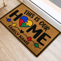 Autism family doormat with puzzle-piece heart artwork shown beside an interior doorway