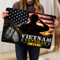 Vietnam veteran doormat held indoors, showing a saluting soldier, dog tags, flag, and service tribute design