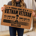 Vietnam Veteran doormat held indoors, featuring a distressed American flag and military boot silhouette