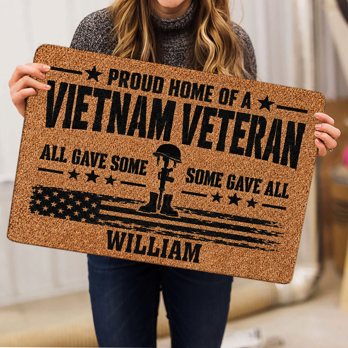 Vietnam Veteran doormat held indoors, featuring a distressed American flag and military boot silhouette