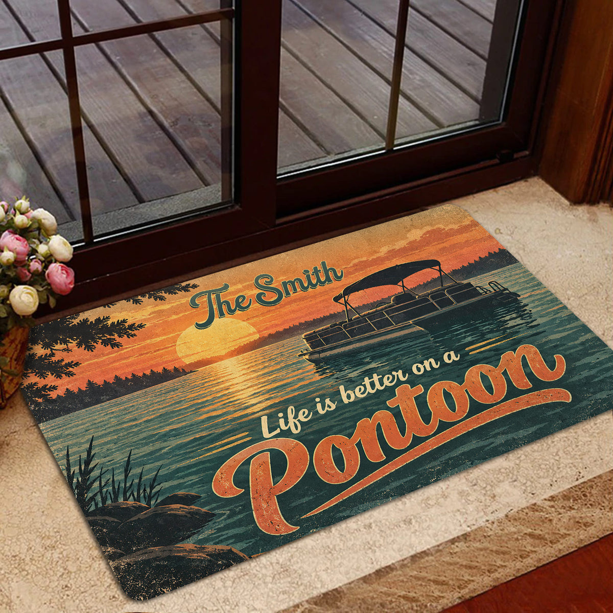 Pontoon doormat displayed at a glass entry door with a lake sunset, shoreline trees, and boat illustration
