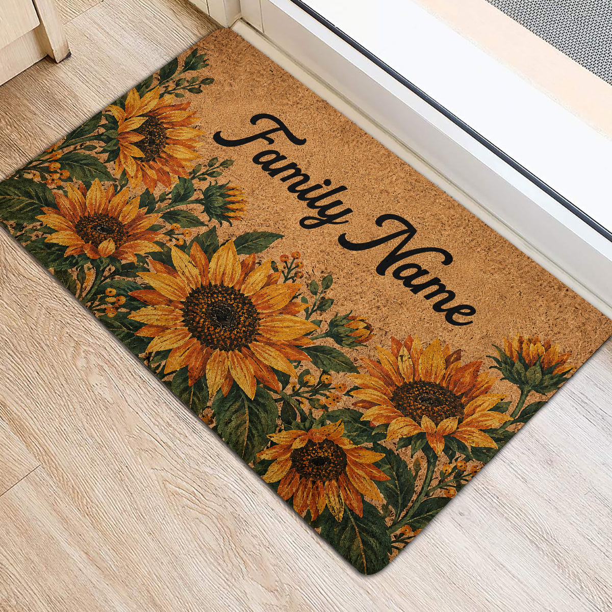 Sunflower door mat positioned at an entryway with golden blooms and script lettering