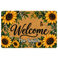 Sunflower welcome doormat with golden blooms, green leaves, butterfly artwork and a central greeting