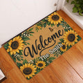 Sunflower welcome mat displayed in a home entryway on warm wood flooring