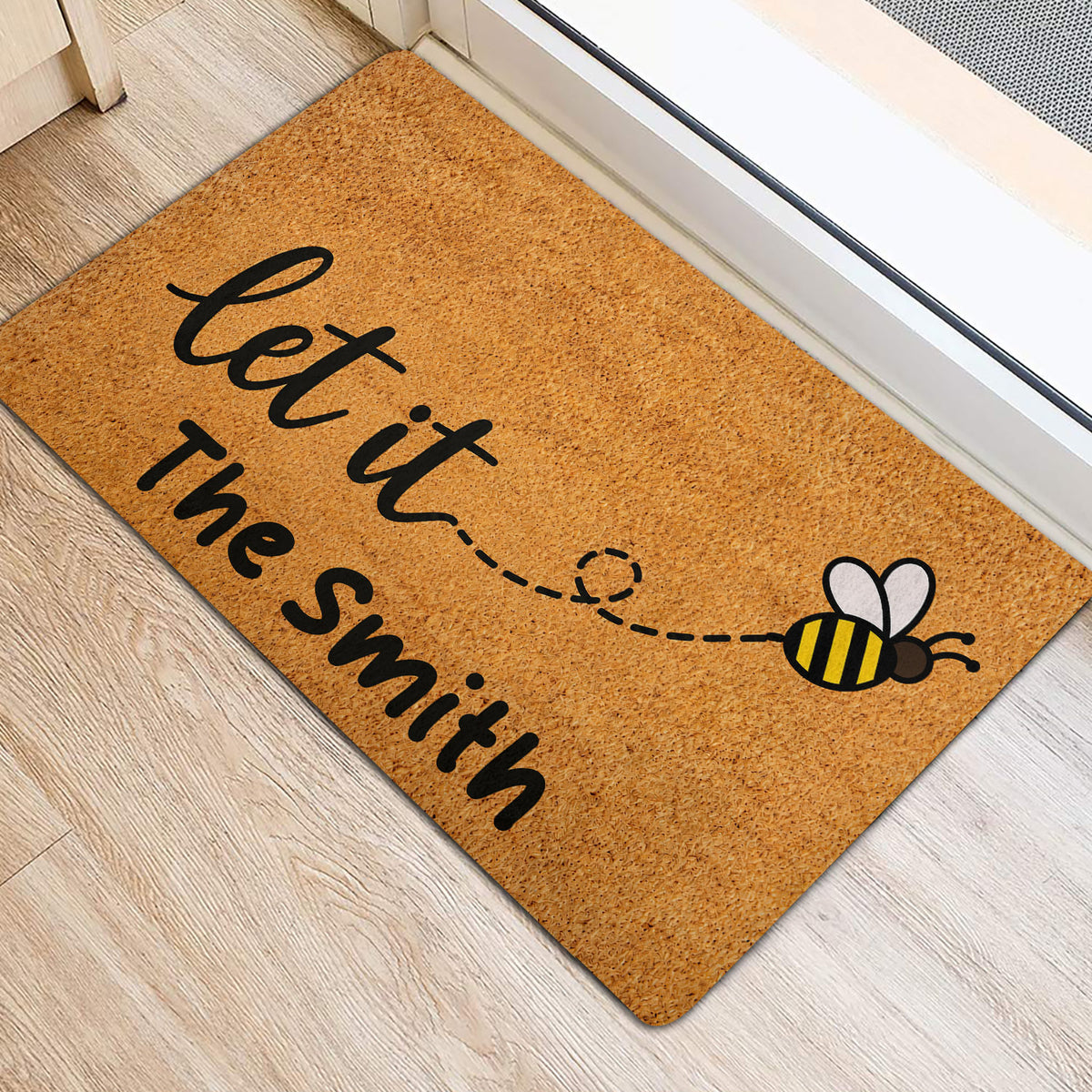 Golden bee entryway mat with a playful flying bee trail and welcome-style lettering