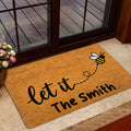Bee-themed front door mat styled in a home entrance with a glass door