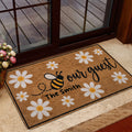Bee and daisy entryway mat styled near a glass door with flowers and a welcoming design