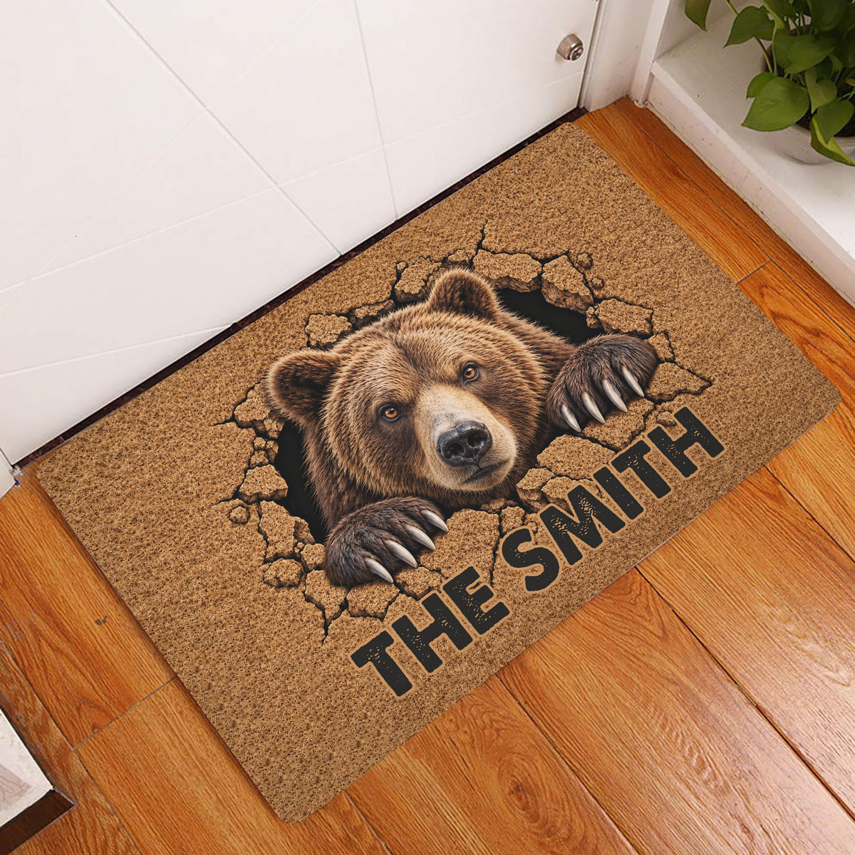 Bear entryway rug displayed in front of a door on a wood floor with a dramatic bear artwork design