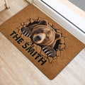 Bear door mat positioned near a doorway on light flooring with realistic wildlife artwork and bold lettering