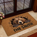 Bear welcome mat shown at a home entrance with a realistic bear breaking through a textured brown surface