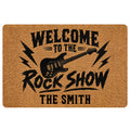 Rock and roll doormat with black electric guitar, lightning bolts, bold lettering, and a warm tan background