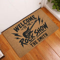 Rock and roll entryway rug displayed beside a white door on a hardwood floor