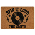 Rock and roll doormat with a black vinyl record, stars, lightning bolts, and bold vintage-style typography