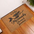 Mermaid entryway doormat displayed by a white door on warm wood flooring