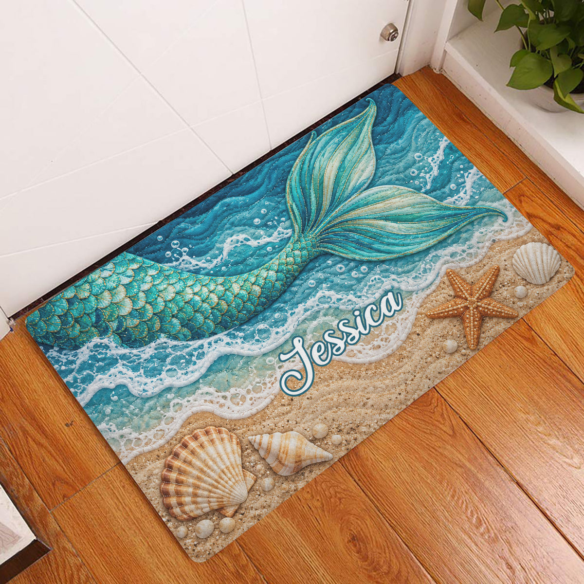 Mermaid beach doormat displayed inside an entryway with ocean waves, shells, and starfish artwork