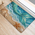 Mermaid tail doormat shown near a doorway with turquoise waves, seashells, and sandy beach details