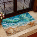 Mermaid entryway mat displayed by a glass door with ocean, shell, and starfish artwork