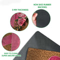 Breast cancer ribbon doormat detail showing textured top, rubber backing, and easy-clean features