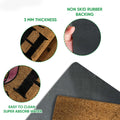 Close-up feature view of breast cancer ribbon doormat surface and dark rubber backing