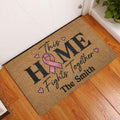 Breast cancer awareness doormat displayed at a home entrance on a wood floor