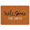 Football-themed welcome doormat with a brown football graphic and warm textured entryway design