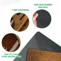 Close-up feature view showing the football doormat surface, folded edge, and black rubber backing