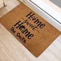Football-themed entryway rug positioned beside a doorway on light wood flooring