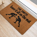 Wrestling entryway mat featuring two grapplers and bold black lettering near a door